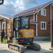 расчистка участка позади коттеджа - миниэкскаватор