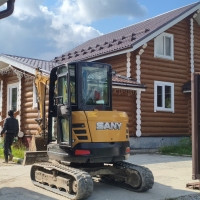 расчистка участка позади коттеджа - миниэкскаватор